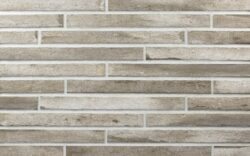 Фасадная клинкерная плитка Taupe длинного формата в тауп и грейдж оттенках на стене