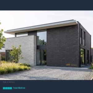 Modern two-tone brick house with a large glass entry, flat roof, and minimalist landscaping of gravel and grasses.