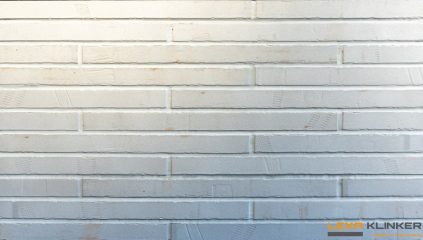 Фасадная клинкерная плитка Piccolo длинного формата в белых и кремово‑серых оттенках